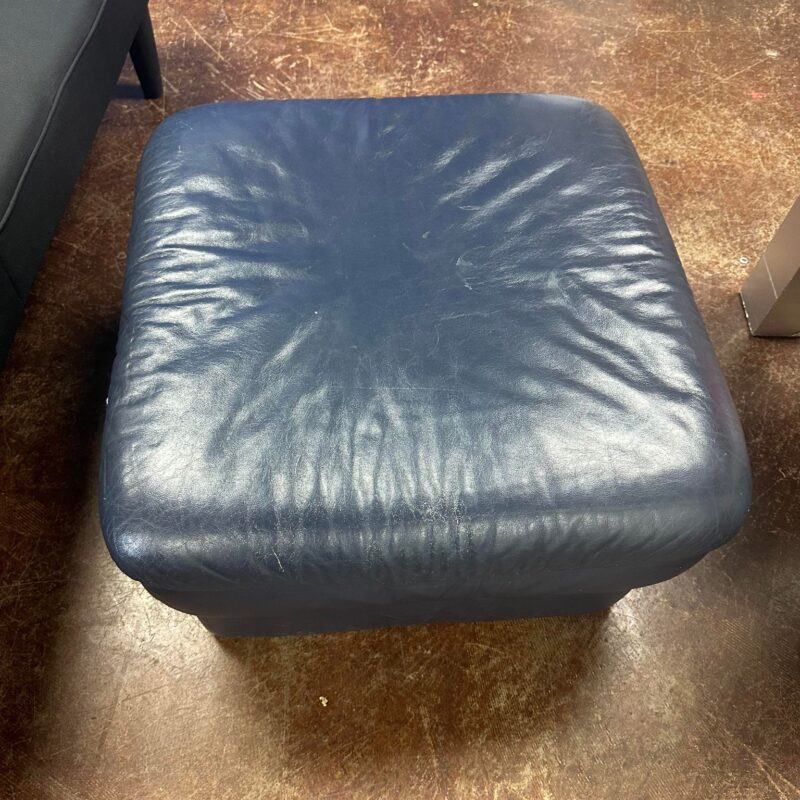 Navy Blue Leather Ottoman from the G. Huenergardt Collection.