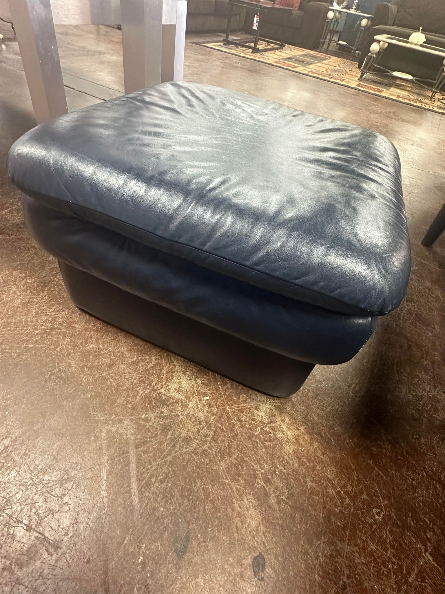 Navy Blue Leather Ottoman from the G. Huenergardt Collection.